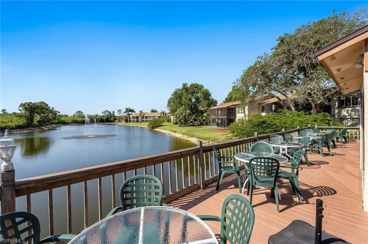 Deck featuring a water view and outdoor dining area