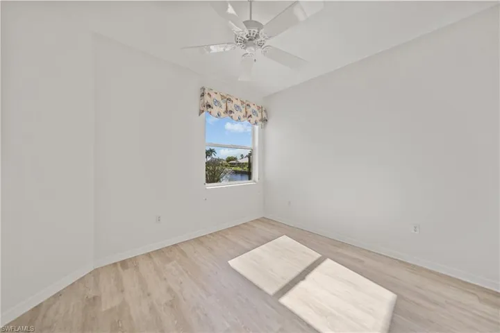 Spare room featuring ceiling fan and light hardwood / wood-style floors