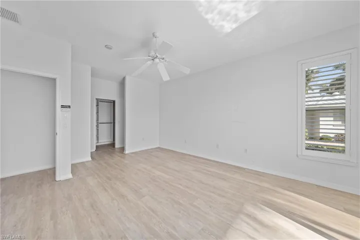 Unfurnished bedroom featuring ceiling fan and light hardwood / wood-style floors