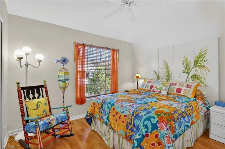 Bedroom with light wood-style flooring and a ceiling fan