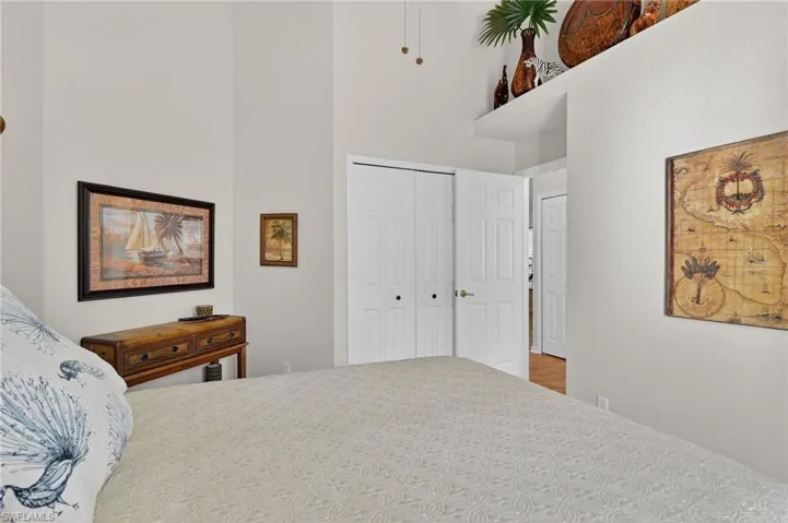Bedroom with a closet and a high ceiling