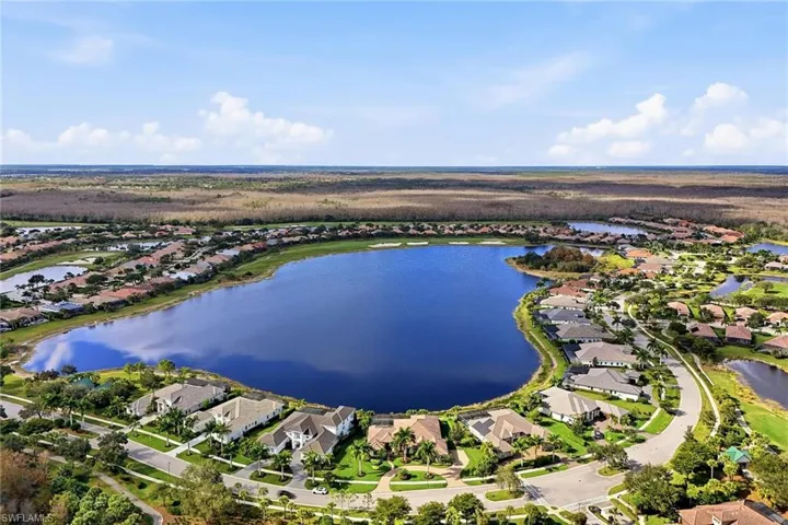 Aerial view of property's location featuring nearby suburban area and a large body of water