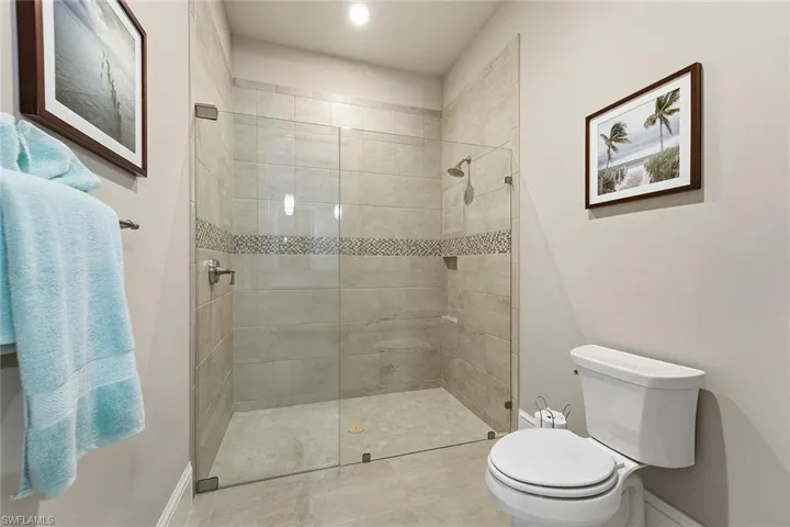 Full bathroom with walk in shower and toilet