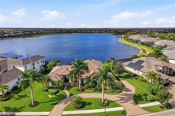 Aerial view of residential area featuring a large body of water