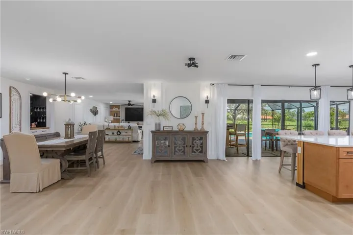 Dining space featuring recessed lighting, visible vents, a notable chandelier, and light wood-type flooring