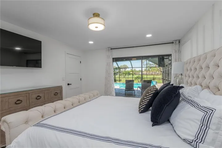 Bedroom featuring a sunroom, recessed lighting, and access to outside