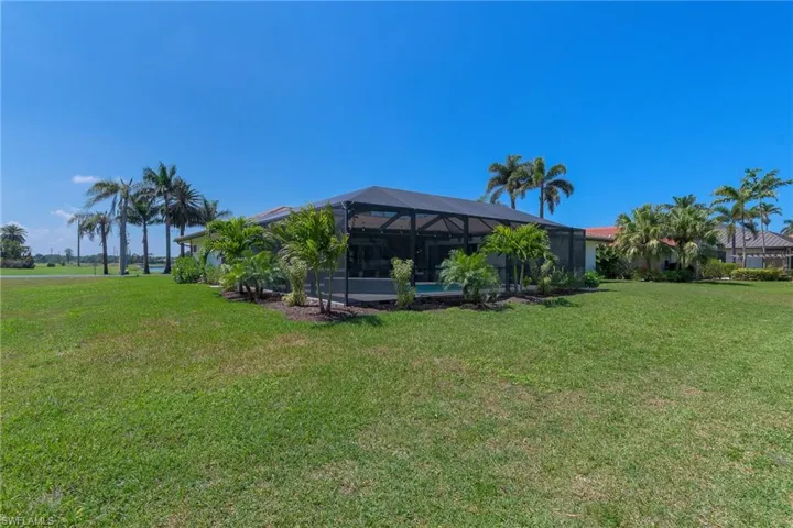 View of yard with a lanai