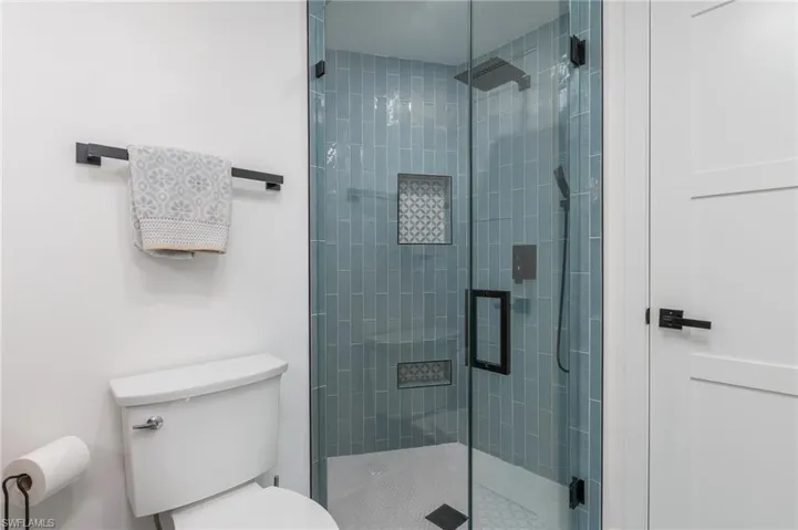 Bathroom with toilet and a shower stall