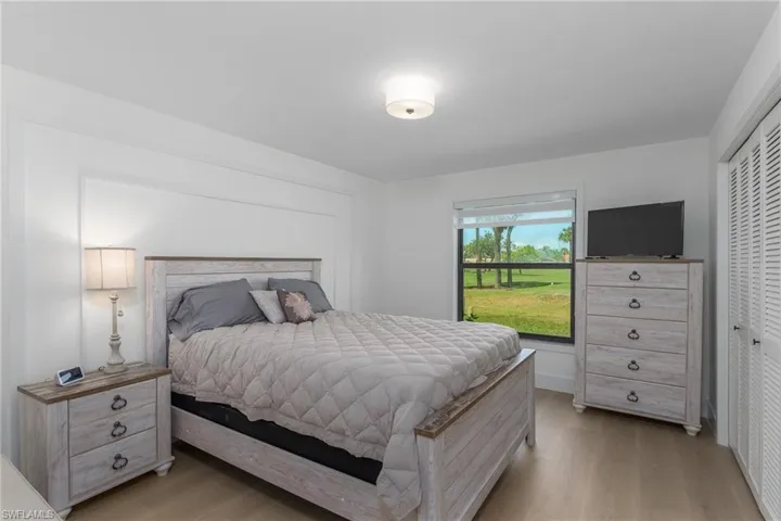 Bedroom with a closet and light wood-type flooring