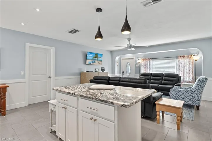 Modern white shaker cabinets with upgraded granite countertops make entertaining a real joy!