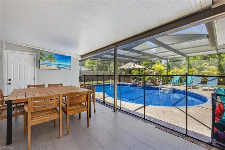 Baby pool fence included.  Great under roof outdoor dining space with TV and teak wood table for 8 people.