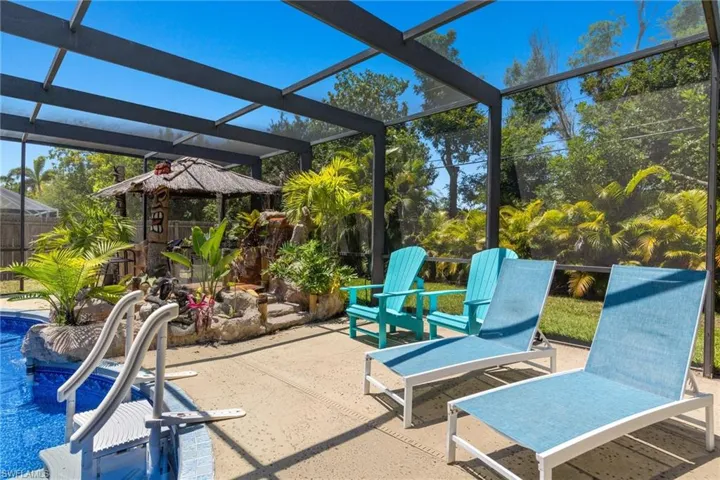 Tons of room for sun loungers and adirondack chairs in the extended pool deck area.  You'll love the relaxing sound of the custom waterfall and stream next to the tiki bar.