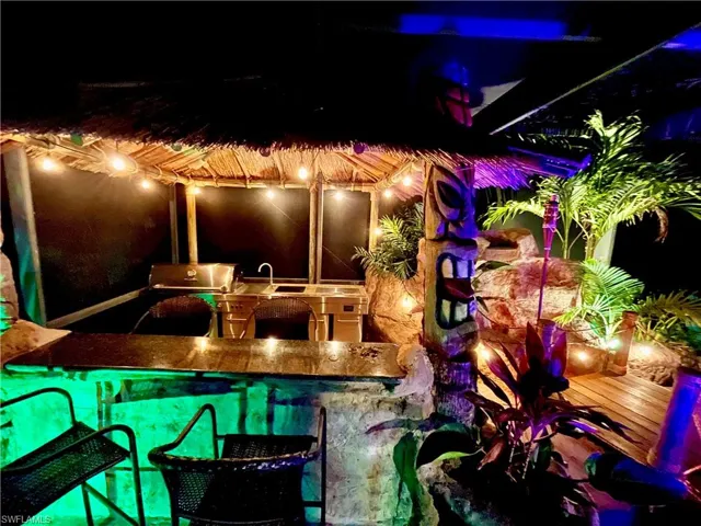Color changing lights around the tiki bar and waterfall.