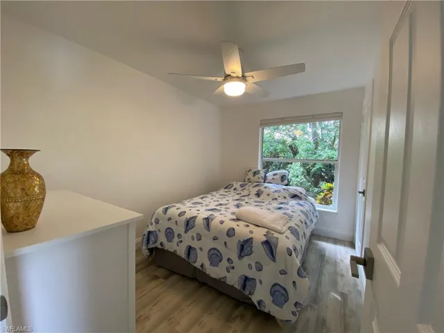 Bedroom featuring light wood-style flooring and a ceiling fan