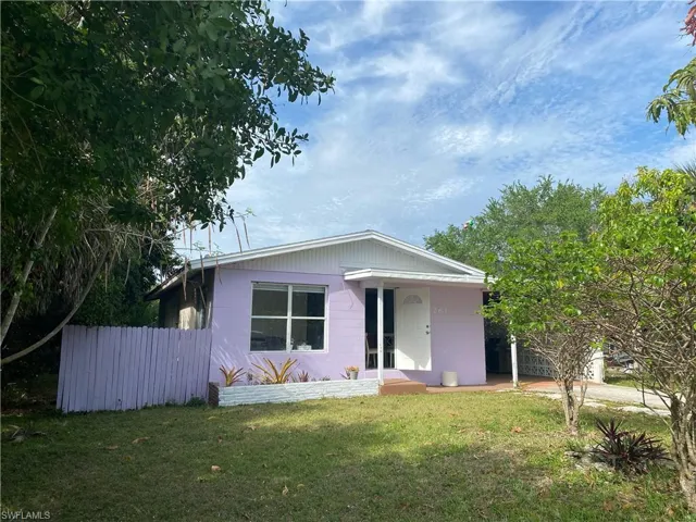 View of front of property featuring concrete block siding