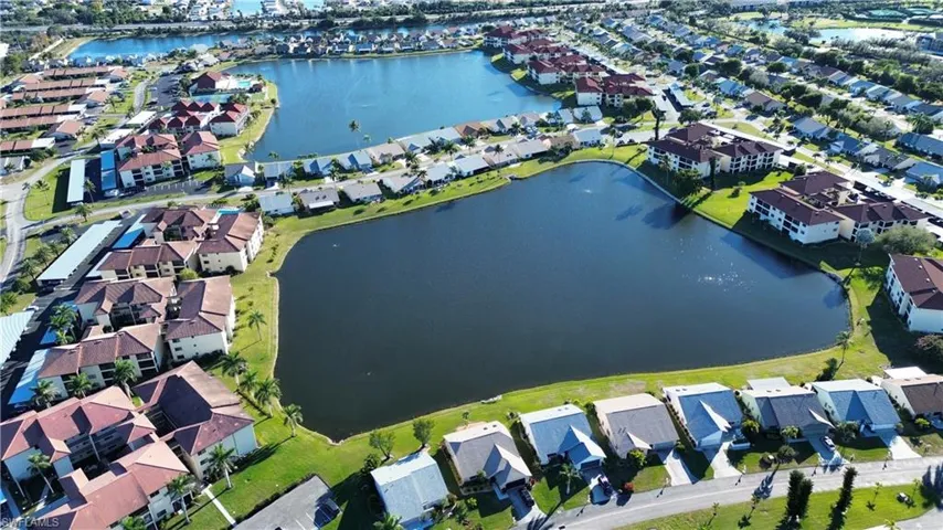 Aerial view of property's location featuring nearby suburban area and a large body of water