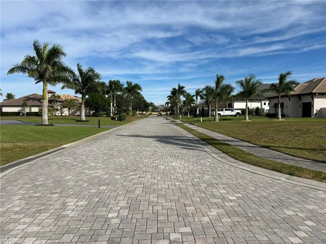 View of street from front of lot with sidewalks and curbs