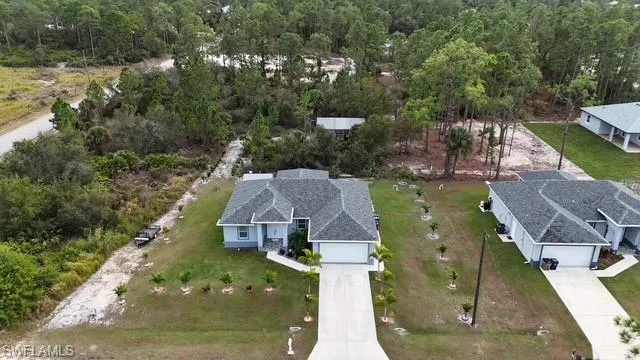 View from above of property with a forest