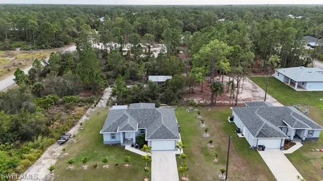 View from above of property with a forest