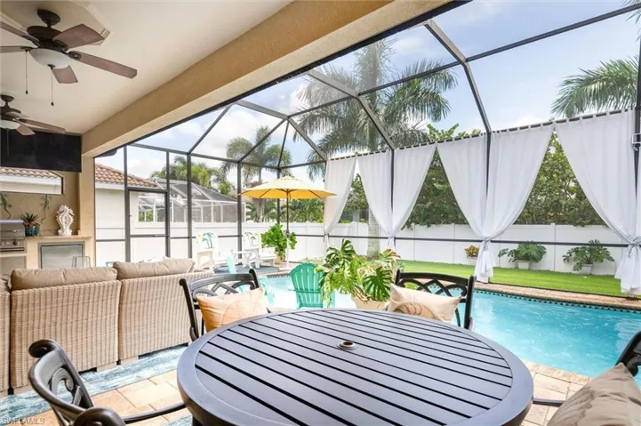 Sunroom / solarium featuring a wealth of natural light and ceiling fan