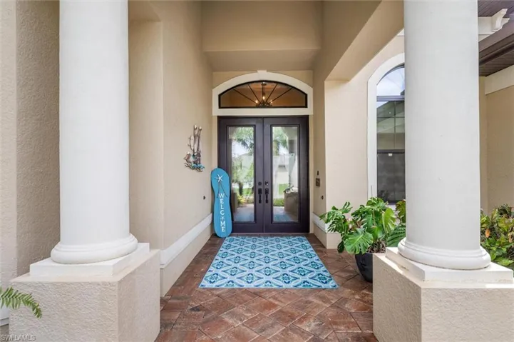 View of exterior entry featuring french doors