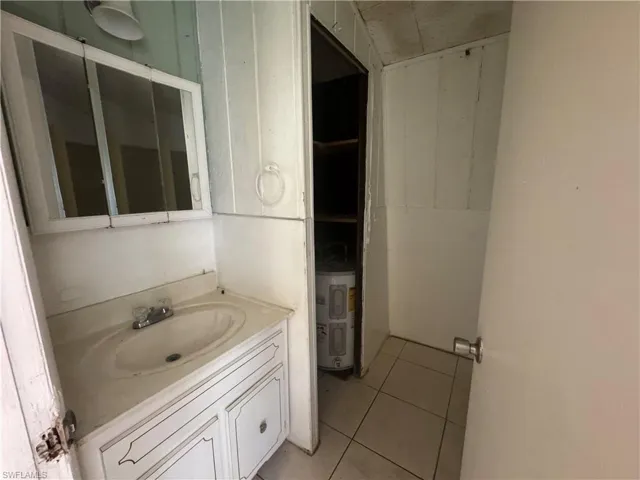 Bathroom with vanity and tile patterned flooring