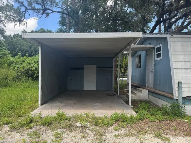 View of car parking featuring an attached carport