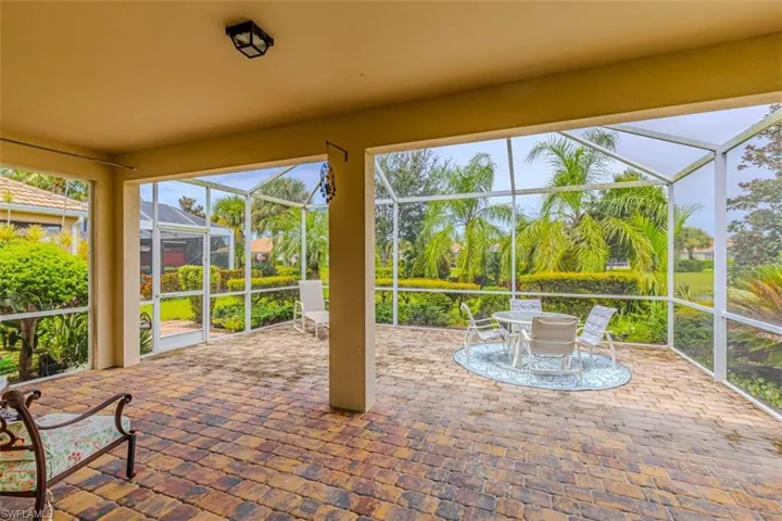 Unfurnished Screened in Lanai with a patio and plenty of natural light