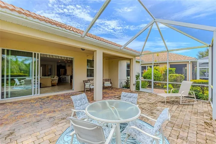Screened in Lanai featuring a patio area and outdoor dining area