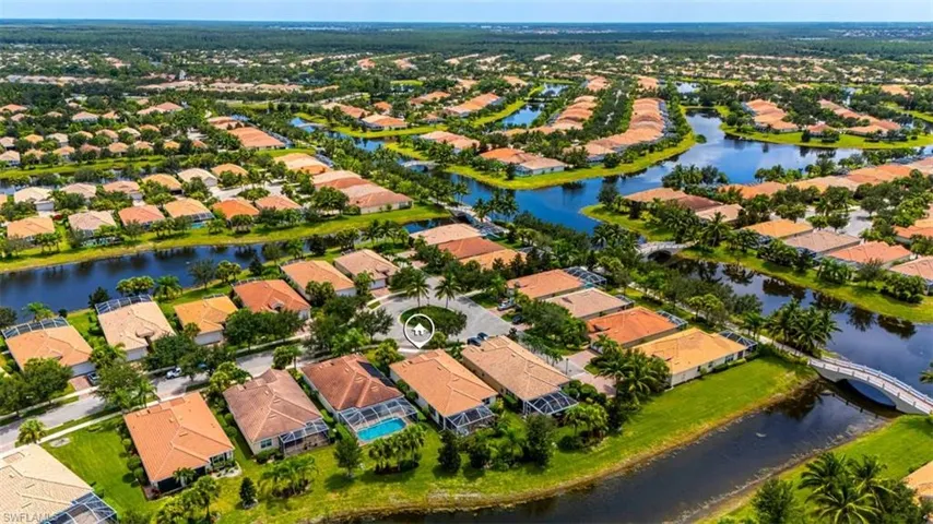 View of property location featuring a nearby body of water and nearby suburban area