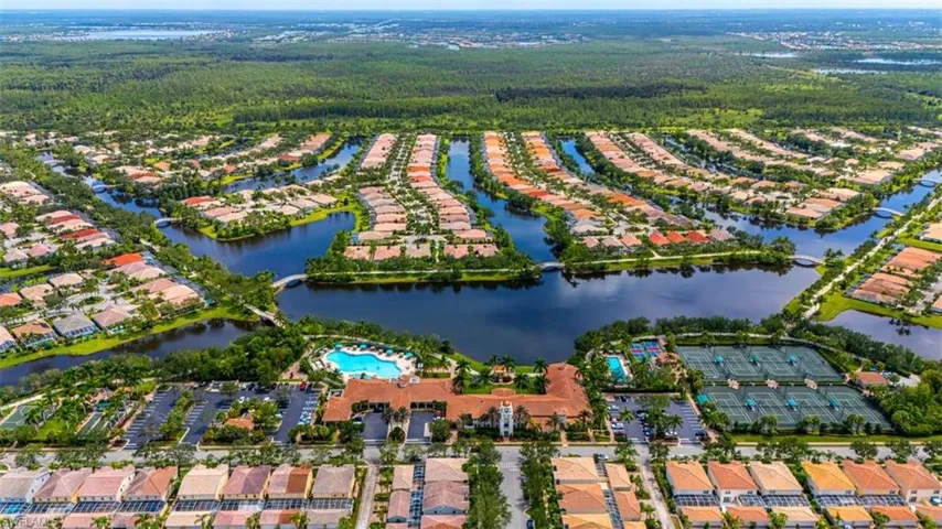 Aerial view of property's location with nearby suburban area and a nearby body of water