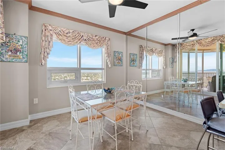 Dining space featuring crown molding and ceiling fan