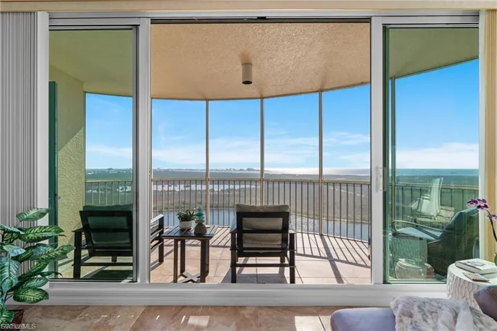 Sunroom with a water view and healthy amount of natural light