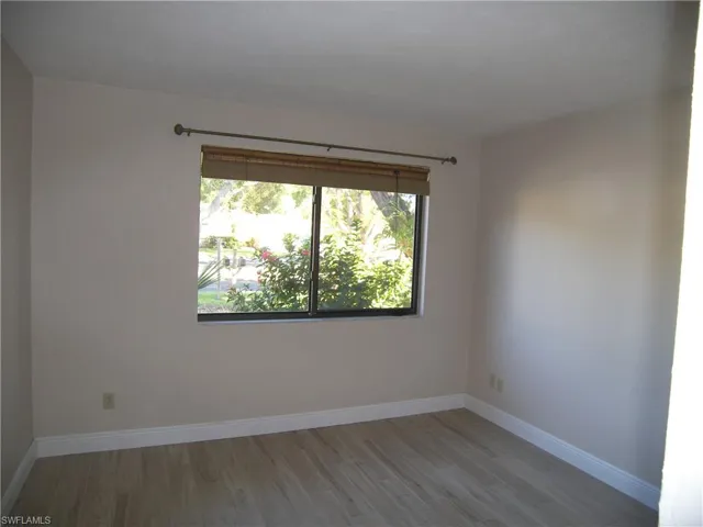 Unfurnished room with light hardwood / wood-style flooring