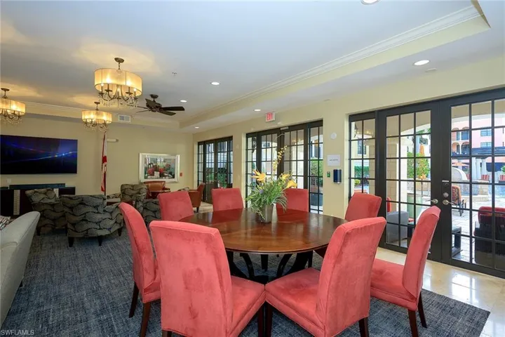 Tiled dining area with recessed lighting, a raised ceiling, visible vents, and crown molding