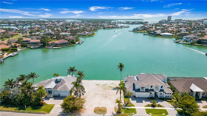 Aerial view of residential area with a nearby body of water