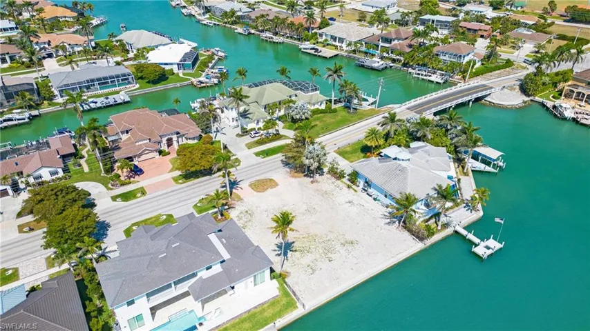 View of property location with nearby suburban area and a large body of water