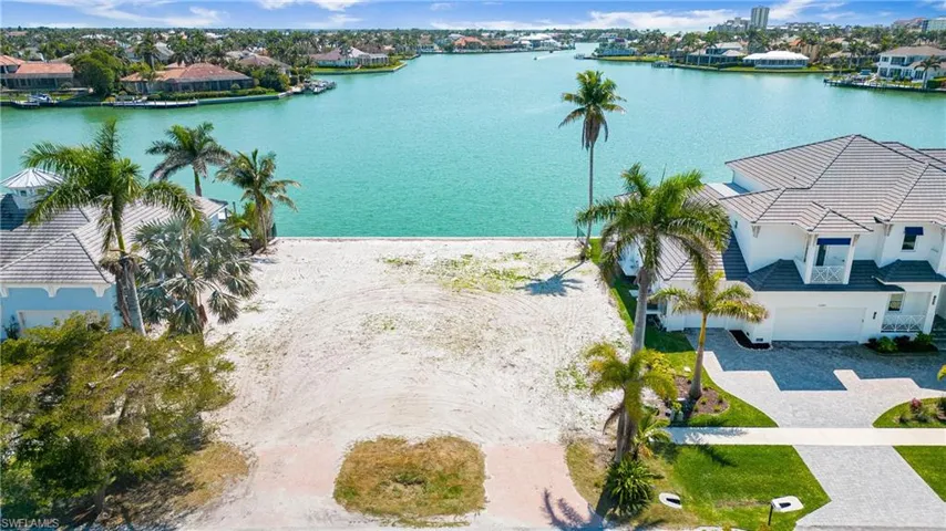 Aerial view of residential area with a large body of water