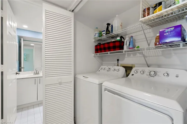 In unit laundry with shelving for added storage