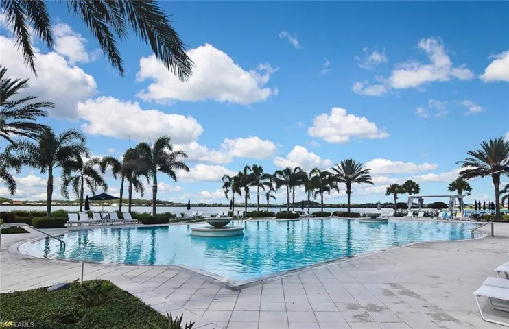 View of pool featuring a water view and a patio area