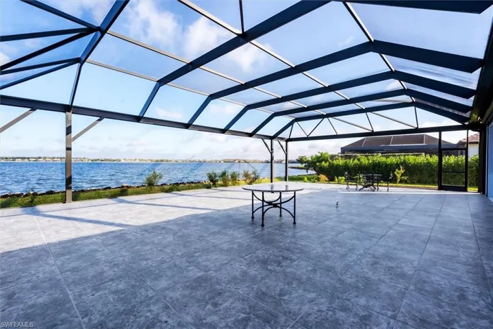 View of home's community featuring a water view and a patio area