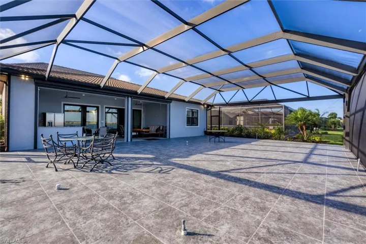 View of patio / terrace with glass enclosure and ceiling fan