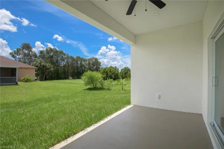 View of under truss open lanai, recess lighting, fan, and additional electrical outlet