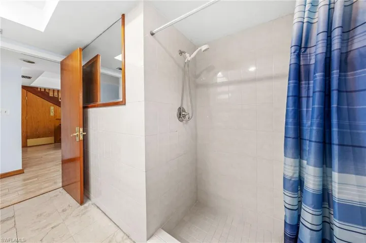 Bathroom with tiled shower