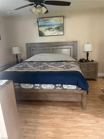 Bedroom featuring light wood finished floors and ceiling fan