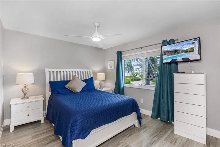 Bedroom with wood finished floors and ceiling fan