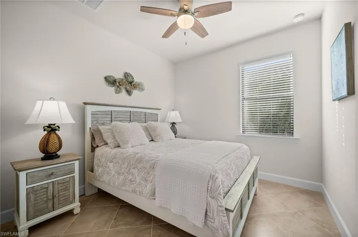 Bedroom featuring a ceiling fan and light tile patterned floors
