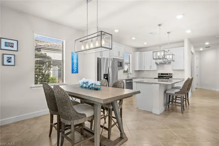Dining room featuring a chandelier and recessed lighting