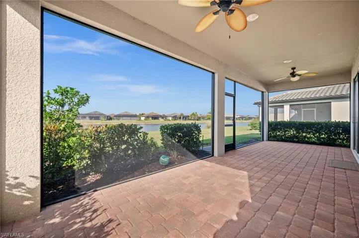 30X10 Lanai featuring ceiling fan, a water view, and a residential view