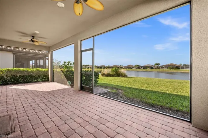 30x10 Lanai featuring a ceiling fan and a water view